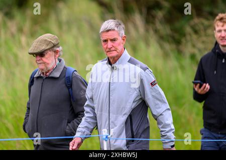 L'ex giocatore dei Rangers e calciatore scozzese Richard Gough tra la folla durante il terzo giorno del Genesis Scottish Open 2024 al Renaissance Club, North Berwick. Data foto: Sabato 13 luglio 2024. Foto Stock