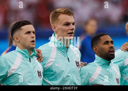 Christoph Baumgartner, Philipp Lienhart, Phillipp Mwene durante la partita di UEFA Euro 2024 tra le squadre nazionali di Polonia e Austria all'Olympiastadion, BE Foto Stock