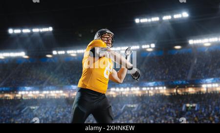 Immagine estetica di un giocatore di football americano che lancia una palla allo stadio con la folla. Partita del Campionato internazionale sull'Arena piena di tifosi. Foto del pass di successo dell'atleta professionista. Foto Stock