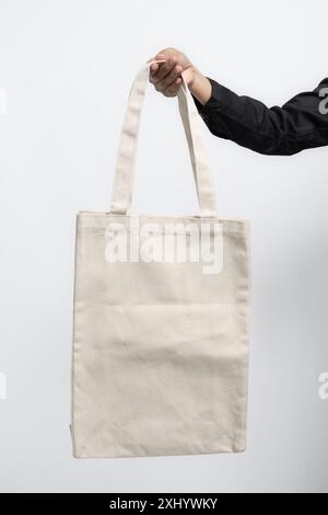 Tela per borsa vuota a mano, ideale per presentazioni di mockup Foto Stock