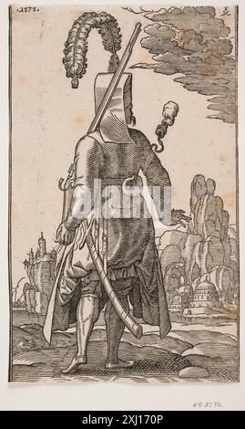 Un'incisione in legno di Lorck raffigurante un giannizzero in piedi da dietro, con copricapo in piuma e un fucile sulla spalla sinistra. Foto Stock