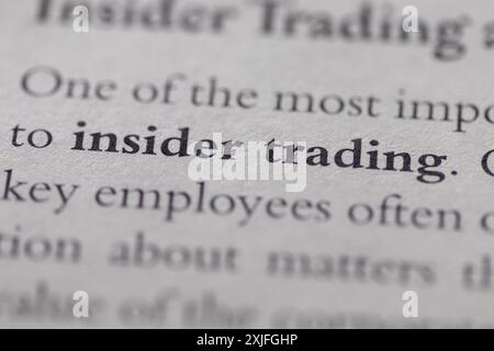 insider trading stampato in testo a pagina come supporto visivo o riferimento al diritto commerciale Foto Stock