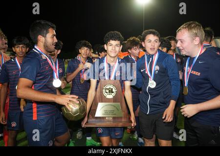 I giocatori dei Seven Lakes celebrano la vittoria del 2-1 sul Lewisville Flower Mound dopo una partita di campionato statale di calcio delle scuole superiori. ©Bob Daemmrich Foto Stock