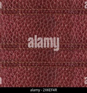 Foto con texture 4K senza cuciture in pelle con cuciture di colore rosso. Foto Stock