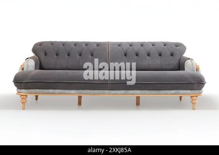 Divano convertibile grigio con dettagli tufted e gambe in legno, ideale per spazi abitativi versatili. Foto Stock