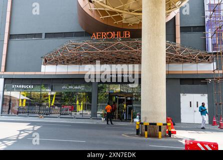 Facciata del centro commerciale Aerohub East presso l'aeroporto internazionale di Chennai a Meenambakkam. Foto Stock