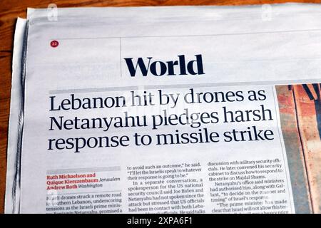 "Libano colpito dai droni mentre Netanyahu promette una risposta dura all'attacco missilistico" testata del quotidiano Guardian 30 luglio 2024 Londra Regno Unito Foto Stock