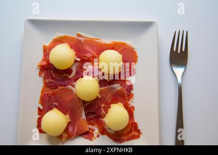 Prosciutto iberico con melone. Foto Stock