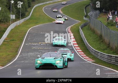 #17 Maxime Dumarey (BEL) / Marek Boekmann (Lautersheim/DEU) / Simon Balcaen (BEL), Aston Martin Vantage AMR GT3, Team: PROsport-Racing (DEU), vor #4 Nico Menzel (Kelberg/DEU) / Timo Glock (DEU), Porsche 911 GT3 911-R, Team: Falken Motorsport (DEU) Falken Motorsport (DEU), Motorsport, Deutschland, Nuerburgring Langstrecken serie, NLS04, Lauf 6, 6H ADAC Ruhr-Pokal Rennen, 03.08.2024 foto: Eibner-Pressefoto/Juergen Augst Foto Stock