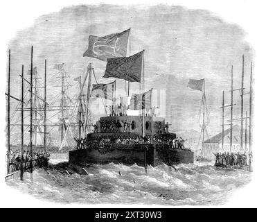 Lancio di H.M.S. Cyclops a Blackwall, 1871. Nave costruita dalla Thames Shipbuilding Company sul fiume Tamigi a Londra, '...per la difesa dei nostri porti di casa...la nave è stata costruita in nove mesi, il che è senza precedenti negli annali della costruzione navale...la Cyclops è una nave a doppia torretta a doppia vite, con uno scafo di 225 piedi. In lunghezza...in avanti e indietro sopra lo scafo c'è un seno rialzato, 117 piedi. lungo per 34 piedi largo, placcato con 6 piedi 6 poll. profondità dell'armatura, con spessore variabile da 8" A 9 poll., e un supporto in teak...questo breastwork...protects i motori e i macchinari per il funzionamento t Foto Stock