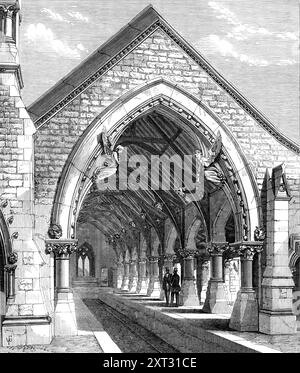 Receiving-House of the Redfern Cemetery, vicino a Sydney, 1870. La succursale ferroviaria del Redfern Cemetery, dove arrivano i treni funebri per depositare le loro tasse, è un bell'edificio gotico, progettato, così come la cappella mortuaria, dal signor James Barnett, architetto coloniale, del New South Wales. Comprende una sala d'attesa e una sala per le donne, con servizi igienici e altre comodità. L'arco d'ingresso, sostenuto su pilastri con capitelli intagliati, sarà decorato con figure scolpite dell'Angelo della morte e dell'Angelo della Risurrezione. Modellato dal defunto signor Thomas Duckett Foto Stock