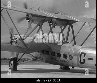 La British Imperial Airways Handley Page 'Hannibal' Biplane Airliner rullò al Radlett Airfield, Hertfordshire, 1931. "London-Paris Airliner". L'Handley Page H.P.42 e l'H.P.45 erano velivoli biplani quadrimotore progettati e prodotti dalla compagnia aerea britannica Handley Page, con sede a Radlett, Hertfordshire. All'epoca erano i più grandi aerei di linea in uso regolare al mondo. Da Time to Remember - A New era, 1931 (Reel 3); documentario sul mondo nei primi anni '1930 Foto Stock
