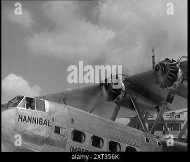 La British Imperial Airways Handley Page 'Hannibal' Biplane Airliner rullò al Radlett Airfield, Hertfordshire, 1931. "London-Paris Airliner". L'Handley Page H.P.42 e l'H.P.45 erano velivoli biplani quadrimotore progettati e prodotti dalla compagnia aerea britannica Handley Page, con sede a Radlett, Hertfordshire. All'epoca erano i più grandi aerei di linea in uso regolare al mondo. Da Time to Remember - A New era, 1931 (Reel 3); documentario sul mondo nei primi anni '1930 Foto Stock
