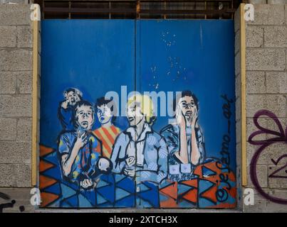 Colorati graffiti politici su un muro nel quartiere Kiryat Hamelacha, Tel Aviv, Israele Foto Stock