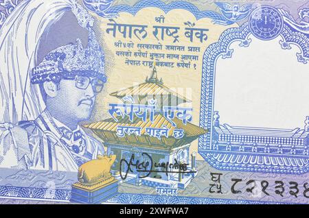 Dritto di 1 banconota di rupie stampata dal Nepal, che mostra il ritratto di re Birendra nel cappello militare e il Tempio di Pashupatinath Foto Stock