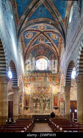 Martirio di San Sebastiano, Martirio di San Sebastiano, affresco di Benozzo Gozzoli, interno con affreschi della Collegiata di Santa Maria Assunta Foto Stock