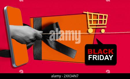 Un telefono viene usato per tagliare un nastro nero, che è legato a un regalo. L'immagine si chiama Black Friday Foto Stock