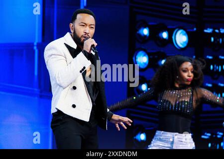 CHICAGO, ILLINOIS - AUGUST 21: John Legend performs during the third day of the Democratic National Convention (DNC) at the United Center on August 21, 2024 in Chicago, Illinois. Delegates, politicians, and Democratic party supporters are gathering in Chicago, as current Vice President Kamala Harris is named her party's presidential nominee. The DNC takes place from August 19-22. Stock Photo