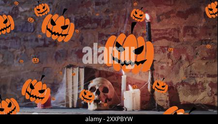 Immagine di zucche di halloween su candele e teschio sullo sfondo della parete di mattoni Foto Stock