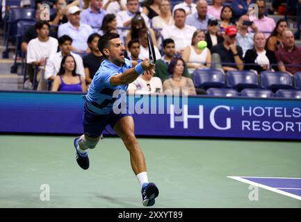 Flushing Meadows, US Open: 26 agosto 2024. Numero 2 seme, Novak Djokovic of, Serbia. In azione contro Radu Albot della Moldavia durante il primo turno del Day One degli US Open. Djokovic ha vinto in serie consecutive Credit: Adam Stoltman/Alamy Live News Foto Stock