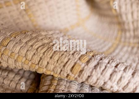 Sfondo decorativo di tessuto rustico in tonalità beige . Carta da parati per prodotti tessili. Spazio per la copia. Foto orizzontale di alta qualità Foto Stock