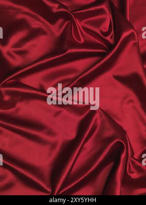 Rosso lucido tessuto setoso sfondo Foto Stock