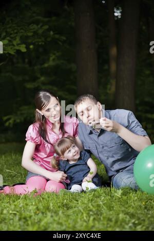 Happy Family Portrait on the Nature background Foto Stock