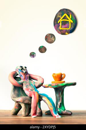 Plastiline si siede in un bar e sogna la propria casa Foto Stock