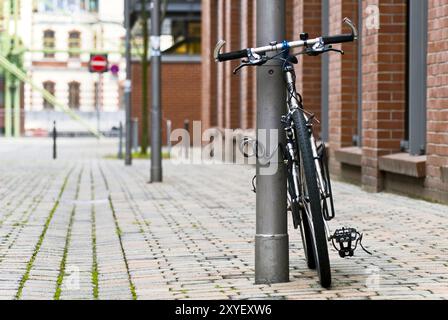 Bicicletta su un lampione Foto Stock