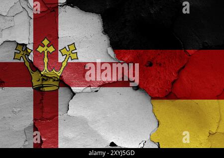 Bandiere di Coblenza e Germania dipinte su pareti fessurate Foto Stock