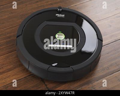 Robot aspirapolvere domestico iRobot Roomba 770 su pavimento in legno duro Foto Stock