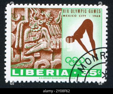 LIBERIA - CIRCA 1968: Francobollo stampato dalla Liberia, mostra la donna subacquea e Xochicalco dalle rovine vicino a Cuernavaca, intorno al 1968 Foto Stock