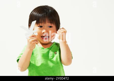 Ragazzo con il simbolo di valuta dello Yen Foto Stock