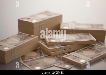 Wad di banconote da diecimila yen Foto Stock