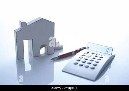 l'immagine commerciale della calcolatrice e della casa Foto Stock