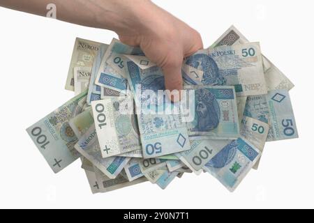 Afferrare a mano banconote polacche di vari tagli Foto Stock