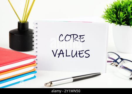 Concetto di business e core value su un foglio bianco di un notebook aperto Foto Stock