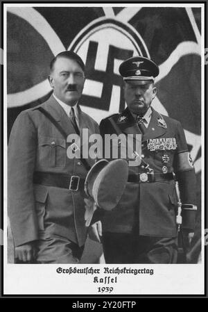 1939, “Greater German Reichskriegertag in Kassel Nazi Germany 1939” con Adolf Hitler e il generale Wilhelm Reinhard davanti a una bandiera di svastica, Kassel 3 giugno 1939, terzo Reich Hitler SS General Wilhelm Reinhard Kassel Veteran's Day 1939 Nazi Germany Foto Stock