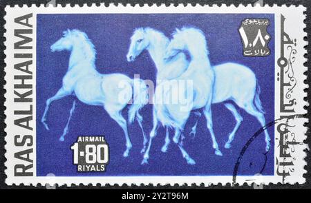 Francobollo cancellato stampato da Ras al Khaimah, che mostra Cavallo Painting, Horse (Equus ferus caballus), circa 1972. Foto Stock