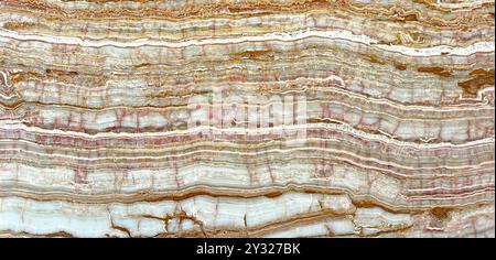 Dessert naturale vena di Onice tagliata nei colori beige e arancio. Chiamato anche rainbow Onyx Veining. Bellissimo onice decorativo con trasparenza per avere luci Foto Stock
