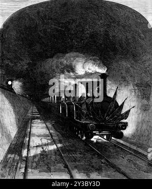 Apertura del tunnel del Mont Cenis: Primo treno, 1871. Tunnel ferroviario - 3,7 km (8,5 miglia) di lunghezza - nelle Alpi europee, che collega Bardonecchia in Italia a Modane in Francia. "Il tunnel del Monte Cenis, come viene ancora chiamato, da Modane, in Savoia, a Bardonn&#xe9;che, in Piemonte, annoiato per 11 miglia e mezzo di spessore di montagna,...dalla scienza e dall'abilità degli ingegneri nativi e dal lavoro degli operai nativi, dal 1857, è stato ufficialmente aperto la domenica settimana. Il tunnel era stato attraversato da diversi treni precedenti un giorno o due prima, cosicché la festa da Torino, arrivando dal "io Foto Stock