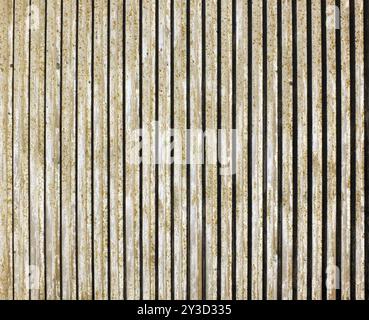 Vecchia parete in cemento pressofuso con linee verticali e design a righe Foto Stock