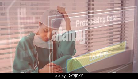Elaborazione dei dati e caricamento delle immagini su un operatore sanitario stanco in ospedale Foto Stock