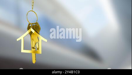 Immagine del portachiavi della casa dorata su sfondo sfocato Foto Stock