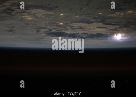 Stazione spaziale Internazionale, orbita terrestre. 17 agosto 2024. Una vista dalla stazione spaziale Internazionale dei lampi illumina le nuvole di tempesta sopra il Mar Cinese meridionale con le luci delle città asiatiche che brillano di notte da 261 miglia sopra, il 17 agosto 2024, nell'orbita terrestre. Credito: Astronaut provided/NASA Photo/Alamy Live News Foto Stock