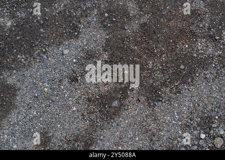 Superfici di terra con un tema di piccole rocce sul terreno Foto Stock