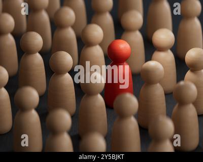 Concetto di discriminazione e inclusione. Le statuette in legno circondavano il rendering rosso.3D su sfondo nero. Foto Stock