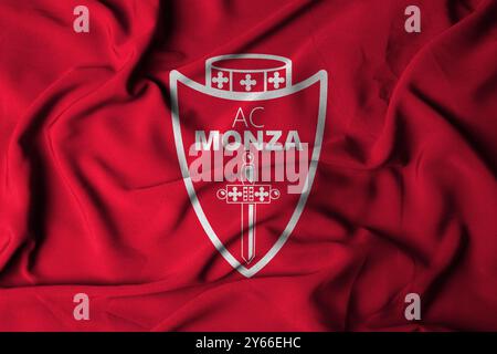 Pringsewu, Lampung 24 settembre 2024; texture del logo Selective Focus flag su sfondo Monza. Bandiera della squadra di calcio di serie A italiana. Illustrazione 3D. Foto Stock