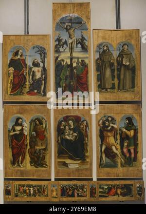 Francesco de Tatti (1470-1532). Pittore italiano, attivo a Varese tra il 1512 e il 1527. Bosto Polyptych, 1517. Da sinistra a destra; registro superiore: Santi Caterina d'Alessandria e Girolamo, Crocifissione, Santi Francesco d'Assisi e Antonio da Padova; registro inferiore: Santi Giovanni Battista e Arcangelo Michele, Vergine e bambino, Santi Cristoforo e Roque. Predella: Saint Himerius, The Flagellation, Saint Peter, Road to Calvary, Saint Paul, la deposizione e Sant'Antonino. Olio sul pannello. Pinacoteca Castello Sforzesco, Milano, Italia. Autore: Francesco de Tatti (1470-1532). Pittore italiano. Foto Stock