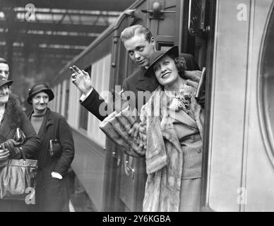 Alla stazione di Waterloo in partenza per l'America. Jimmy Donaghue (Backer) e Miss Ruth Etting (23 novembre 1896 - 24 settembre 1978) sono state una star statunitense degli anni '1930, che ha registrato più di sessanta hit) del "Transatlantic Rythm" Show. 7 ottobre 1936 © TopFoto Foto Stock